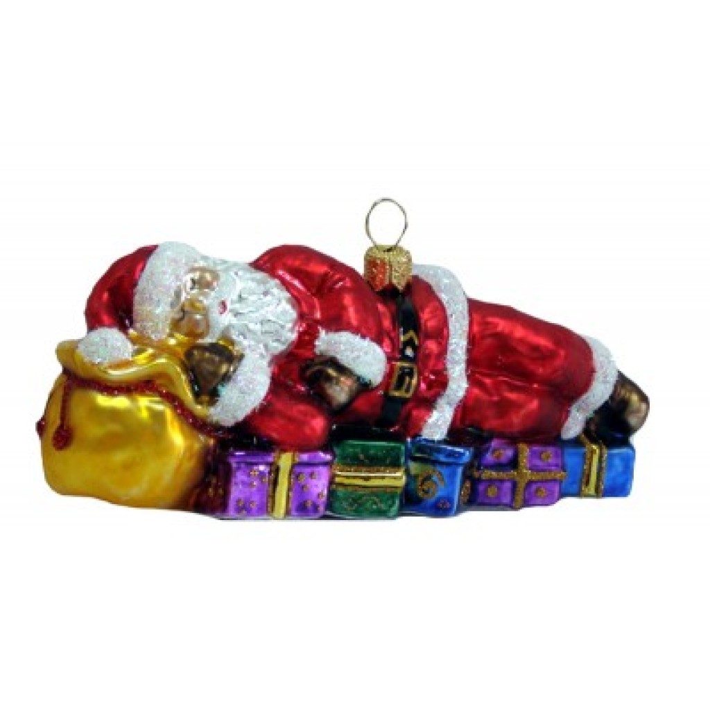 Christbaumschmuck Weihnachtsmann ruht auf seinen Geschenken Christbaumschmuck Weihnachtsmann ruht auf seinen Geschenken